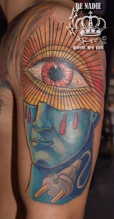 Eye and plug tattoo